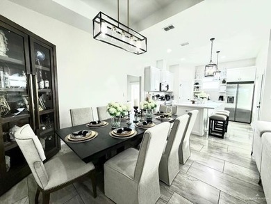 Stunning golf-course home located in a highly sought-after gated - photo 9