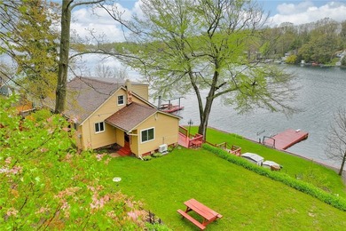 Tucked into the hillside, this awesome lakefront home offers so - photo 1