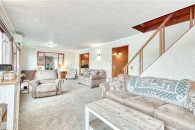 Tucked into the hillside, this awesome lakefront home offers so - photo 10
