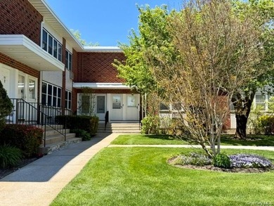 Beautiful County Club Gardens Lower Level Unit Awaits You! This - photo 1