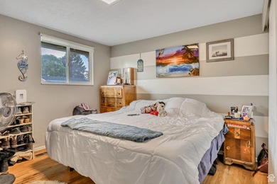 Welcome to this charming West Jordan home featuring 4 spacious