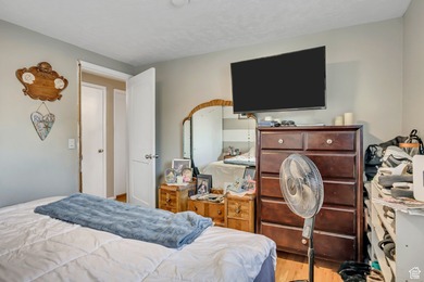 Welcome to this charming West Jordan home featuring 4 spacious