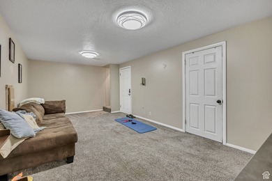 Welcome to this charming West Jordan home featuring 4 spacious