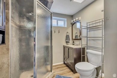 Welcome to this charming West Jordan home featuring 4 spacious