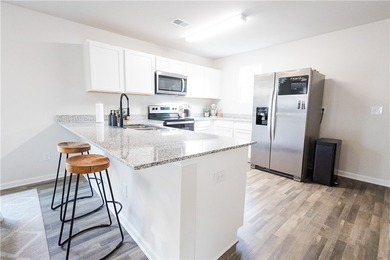 Nestled in the Palmetto Place community, this 3-bedroom, 2 - photo 4