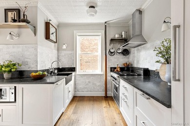 Perched above the treetops of Prospect Park, Residence 3L at 86 - photo 4