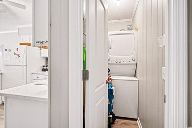 This bright two-bedroom, two-bath condominium is perched in a - photo 11