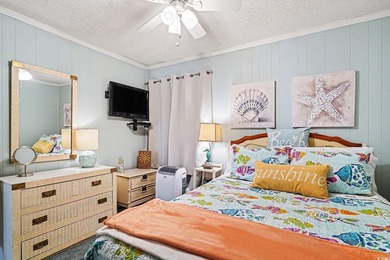 This bright two-bedroom, two-bath condominium is perched in a - photo 14