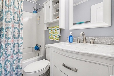This bright two-bedroom, two-bath condominium is perched in a - photo 15