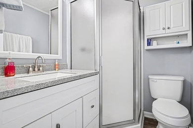This bright two-bedroom, two-bath condominium is perched in a - photo 20