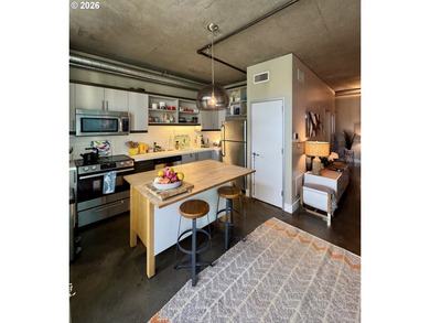 Experience elevated urban living in this refined corner unit