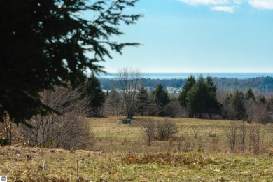 With huge views of Lake Michigan and Portage Lake, this approx - Lake Acreage For Sale in Onekama, Michigan