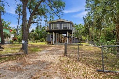Discover the ultimate Suwannee, FL waterfront retreat with this - photo 2
