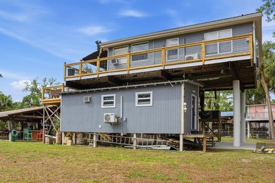 Discover the ultimate Suwannee, FL waterfront retreat with this - photo 9