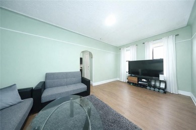 Introducing this rare, large full-brick two-family home located - photo 4