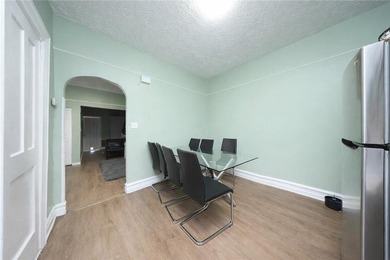 Introducing this rare, large full-brick two-family home located - photo 5