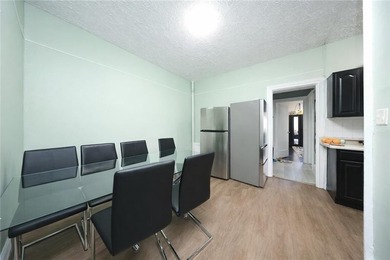 Introducing this rare, large full-brick two-family home located - photo 8
