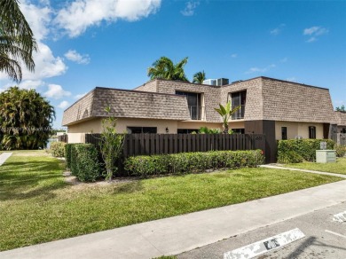 Lake Townhome/Townhouse For Sale in Palm Springs, Florida
