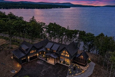 Perched high above the shimmering waters of Lake Winnisquam in - photo 2