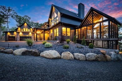 Perched high above the shimmering waters of Lake Winnisquam in - photo 3