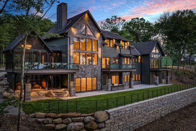 Perched high above the shimmering waters of Lake Winnisquam in - photo 4