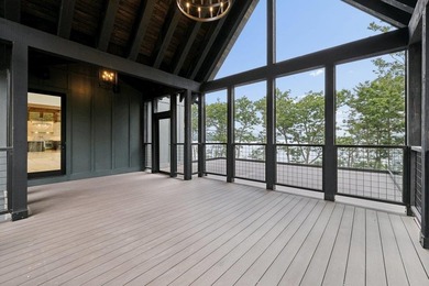 Perched high above the shimmering waters of Lake Winnisquam in - photo 7