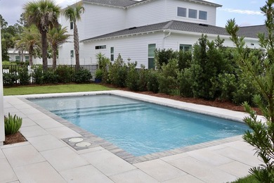 Check out the new pool deck & landscaping! Enjoy an amenity-rich - photo 4