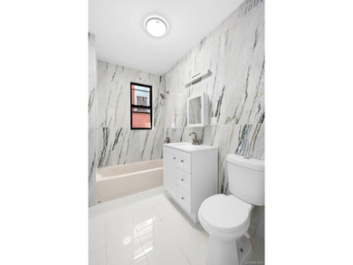 Welcome to 346 E 53rd St., a beautifully renovated semi-detached - photo 6