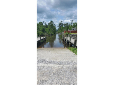 10 waterfront lots in Bayou Phillips Estate. Canal empties into - photo 4