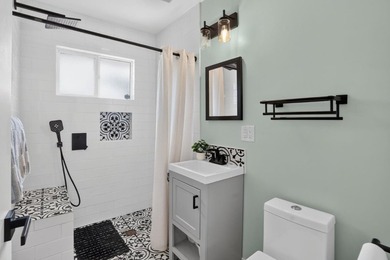 Tucked behind a charming brick-enclosed patio, this 3 bedroom - photo 18