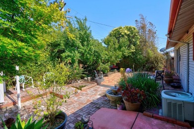Tucked behind a charming brick-enclosed patio, this 3 bedroom - photo 25