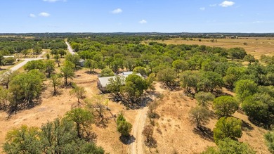 Located in the heart of Stonewall, Texas, this exceptional 10 - photo 3