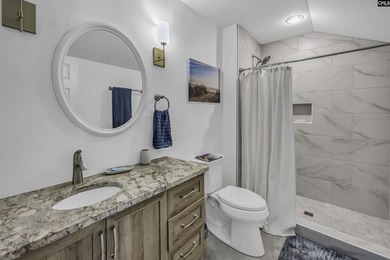 Modern comfort meets relaxed lake living on this spacious 1-acre - photo 17