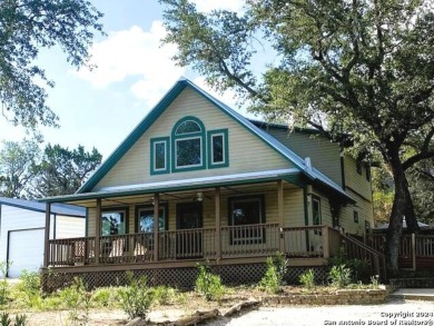 Imagine a charming country home designed to blend rustic - Lake Home For Sale in Lakehills, Texas