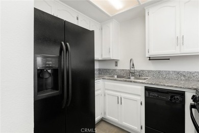 Welcome to this bright and inviting top-floor condominium in one - photo 12