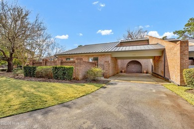 Coveted Landfall townhouse condominium in Colony Club! This end