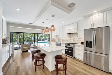 The finest Fully Renovated waterfront home in Coral Ridge with - photo 9