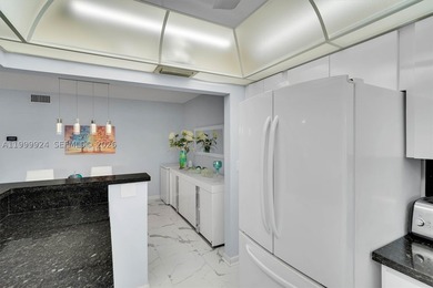 PRISTINE CONDITION and TOTALLY REMODELED unit in this IDEAL - photo 17