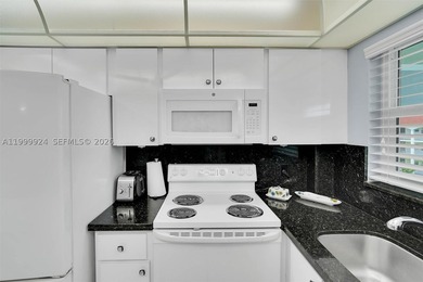 PRISTINE CONDITION and TOTALLY REMODELED unit in this IDEAL - photo 27