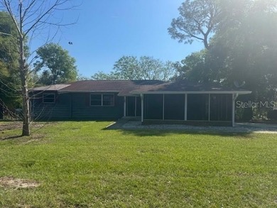 Welcome to this charming 3-bedroom, 2-bathroom pool home located - photo 2