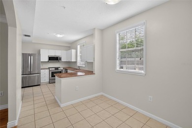 FRESHLY PAINTED AND NEW CARPETING: Beautiful townhome-style - photo 13