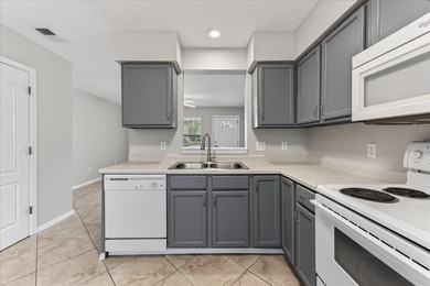 Freshly painted 2-bedroom, 2-bath townhome-style condo in a - photo 10