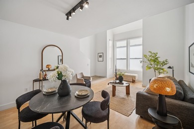 Welcome to Midtown Lofts! This chic, two-story condo unit boasts