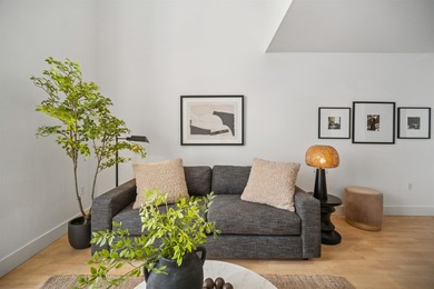 Welcome to Midtown Lofts! This chic, two-story condo unit boasts