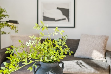 Welcome to Midtown Lofts! This chic, two-story condo unit boasts