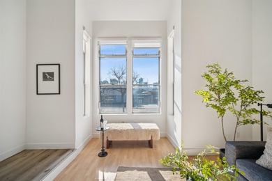 Welcome to Midtown Lofts! This chic, two-story condo unit boasts