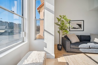 Welcome to Midtown Lofts! This chic, two-story condo unit boasts