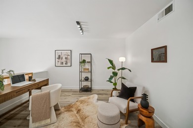 Welcome to Midtown Lofts! This chic, two-story condo unit boasts