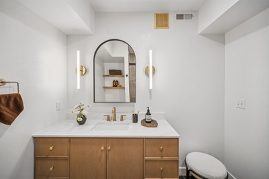 Welcome to Midtown Lofts! This chic, two-story condo unit boasts