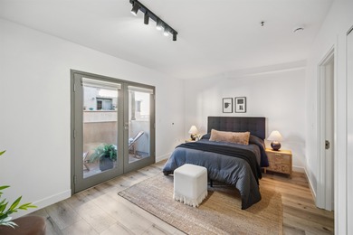 Welcome to Midtown Lofts! This chic, two-story condo unit boasts